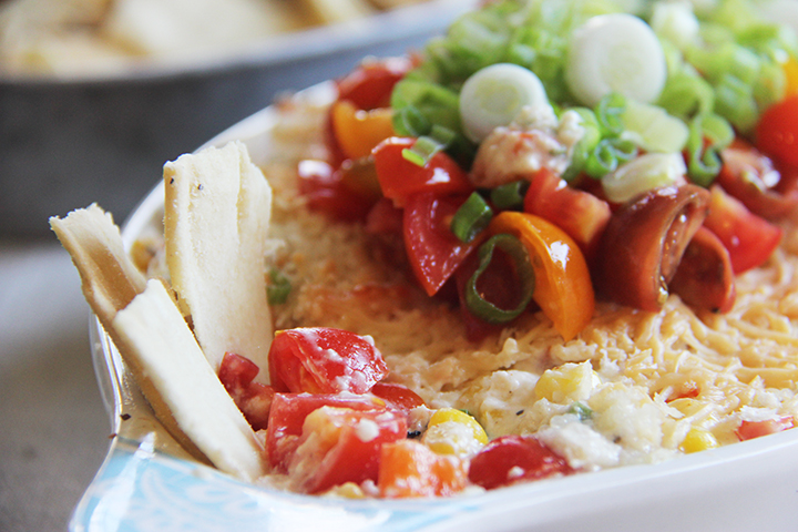 Spicy Cheesy Corn Dip is festive, fun, and oh so delicious! 