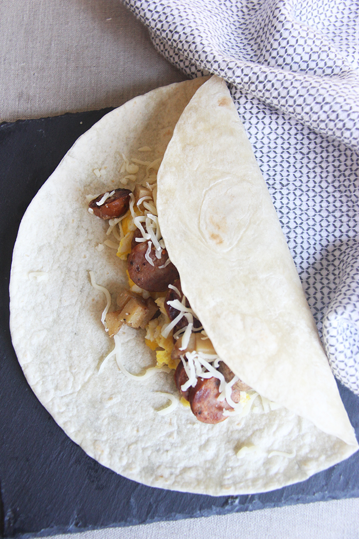 Hearty, tasty, and freezer-friendly breakfast burrito. An easy and delicious spin on the usual breakfast routine and a great solution to morning craziness! 