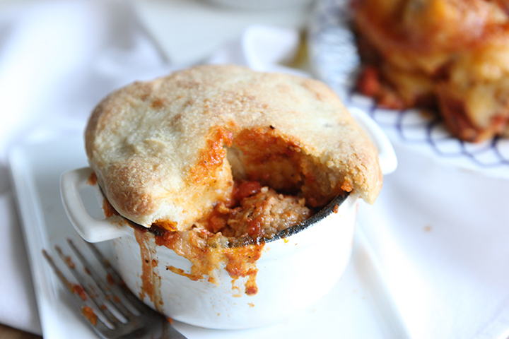 A twist on your regular pizza - meatball marinara pizza pot pie! Gooey goodness, no pizza cutter required, and easily customized with your favorite ingredients.