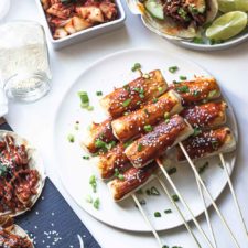 This grilled tteokbokki is a popular Korean street food that comes in the form of a sweet and chewy rice cake. A delicious Asian sauce soaks these rice cakes (or more appropriately, rolls) once they’ve been grilled to perfection. These spicy, Korean rice cakes are usually about the size of a thumb and have the perfect light crisp on the outside with a delightfully chewy center.