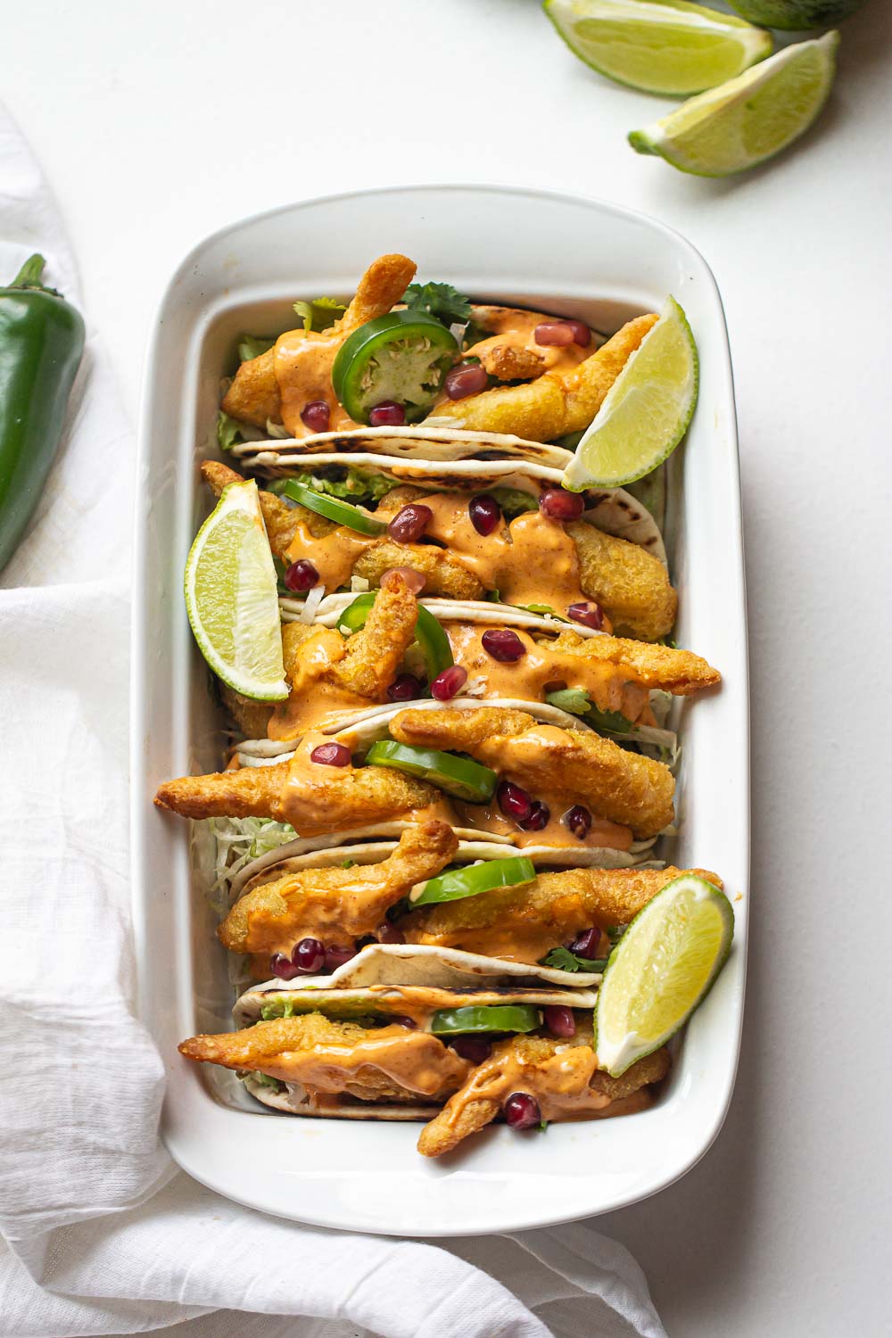 These one-pan Easy Spicy Shrimp Tacos are packed with all of the flavors you love and topped with an easy sriracha mayo sauce! This is the definition of summer tacos. Quick, easy, and delicious!