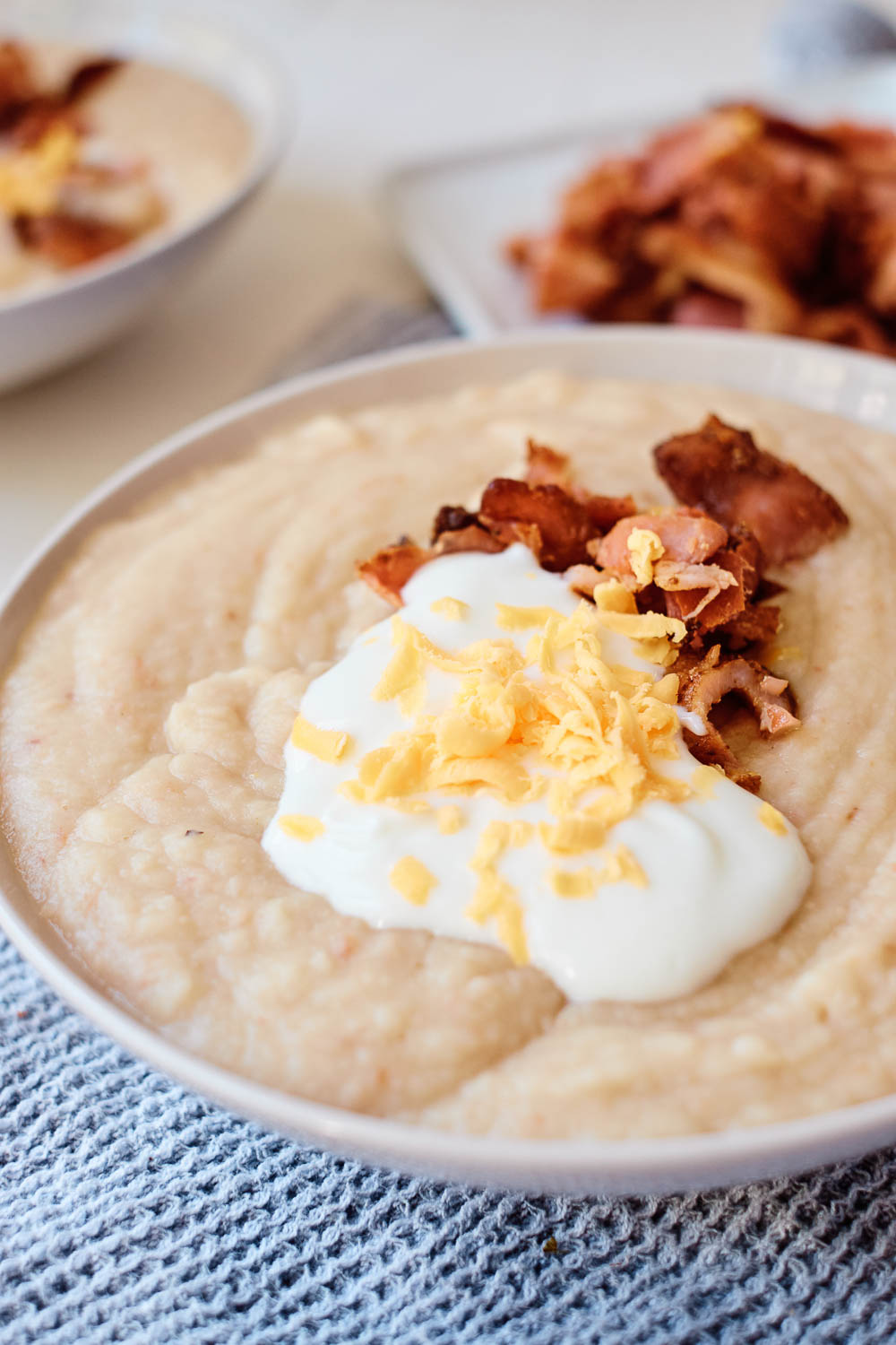 This Baked Potato & Cauliflower Soup has a thick and creamy broth that's loaded with onion and bacon. It is the definition of comfort food that also makes a delicious winter-warmer soup.