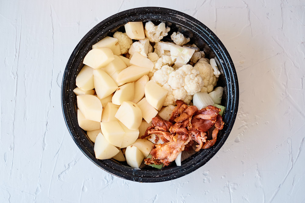 This Baked Potato & Cauliflower Soup has a thick and creamy broth that's loaded with onion and bacon. It is the definition of comfort food that also makes a delicious winter-warmer soup.