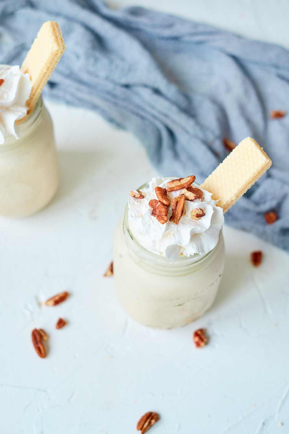 Pecan Pie Milkshake - a boozy milkshake with bourbon, butter pecan ice cream, and almond milk! A delicious spin of your Thanksgiving dessert that can be ready in 5 minutes! It can easily be doubled, tripled, or even quadrupled to satisfy a group and comes together in minutes — perfection! 