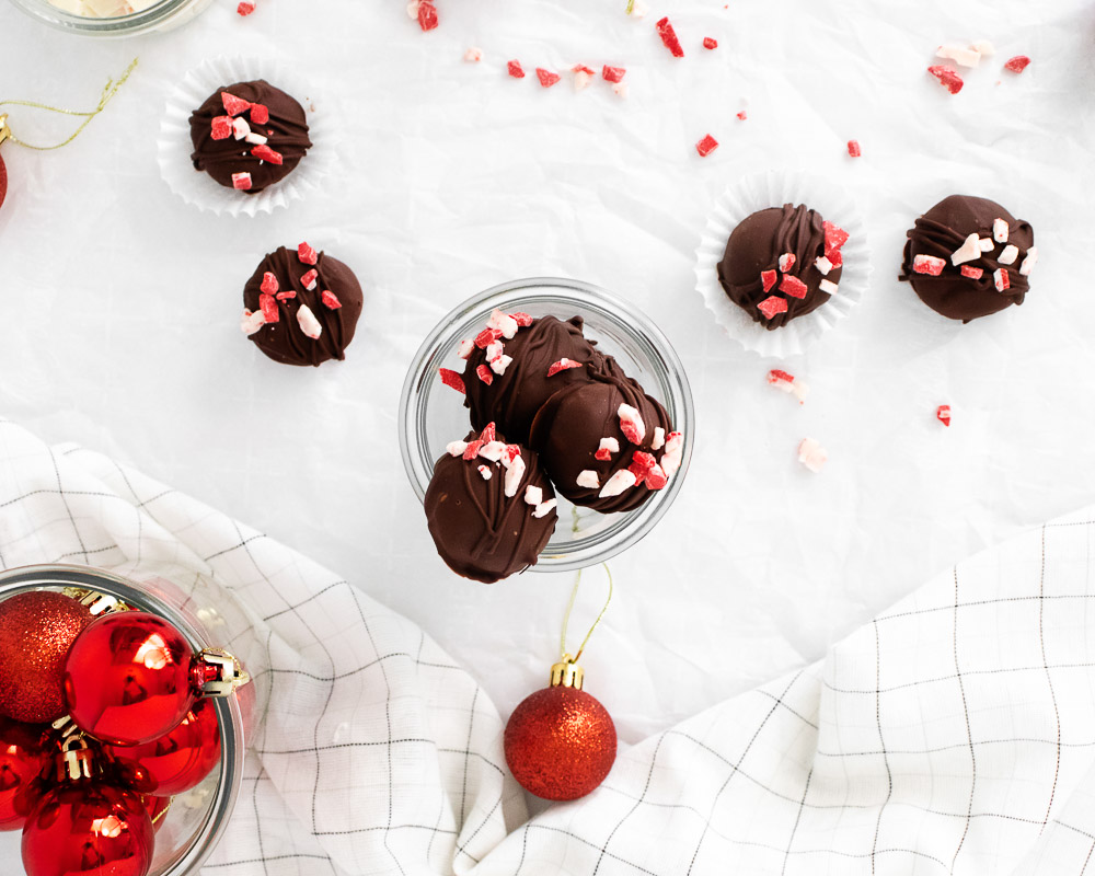 Fun and festive, these easy Peppermint Bark Truffles require no baking and take 4 ingredients to make. The perfect combination of rich, melt in your mouth dark chocolate and peppermint flavors - that's it!