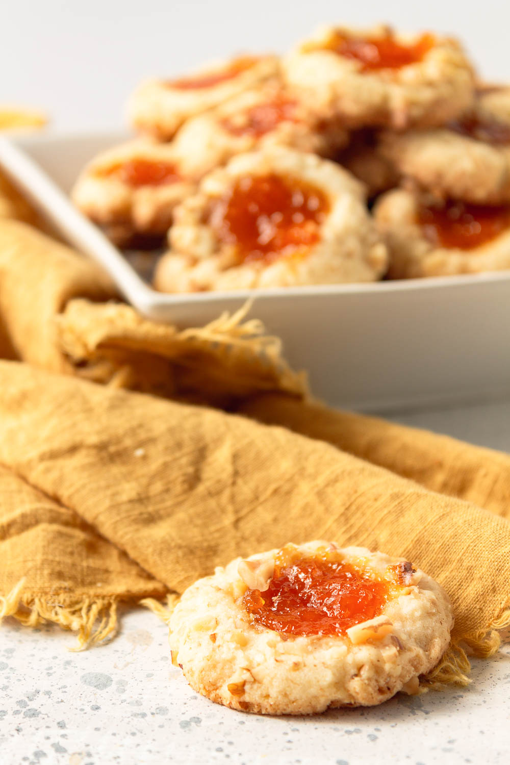 These classic Apricot Walnut Thumbprint Cookies are so delicious you’ll want to make them all year. These thumbprint cookies are adorable and melt in your mouth!