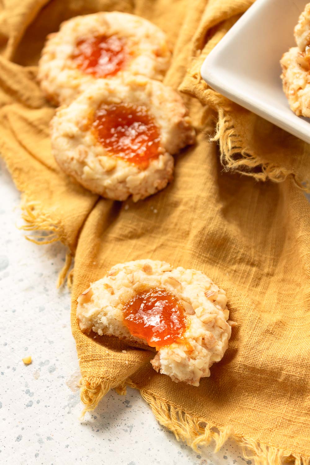 These classic Apricot Walnut Thumbprint Cookies are so delicious you’ll want to make them all year. These thumbprint cookies are adorable and melt in your mouth!