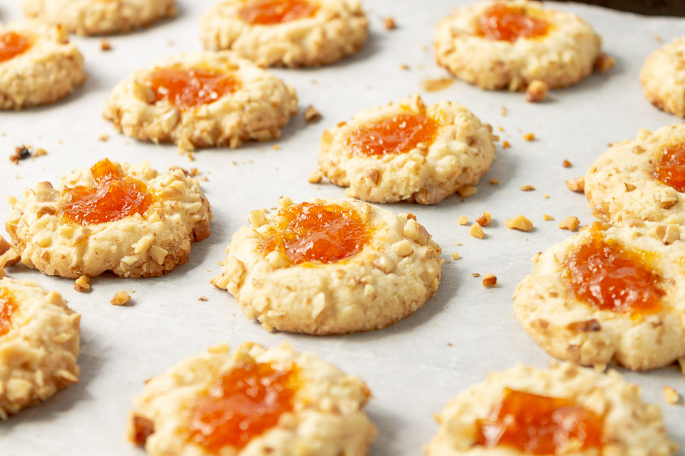 These classic Apricot Walnut Thumbprint Cookies are so delicious you’ll want to make them all year. These thumbprint cookies are adorable and melt in your mouth!