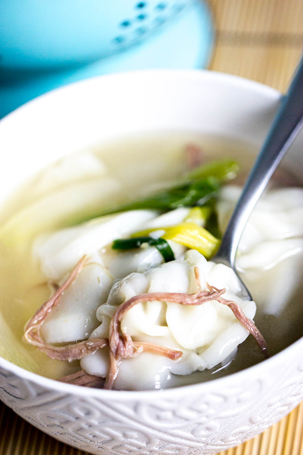 Korean rice cake soup with dumpling (Tteok Mandu Guk) is a soothing and hearty soup. The clear broth signifies purity and the rice cakes symbolize prosperity.