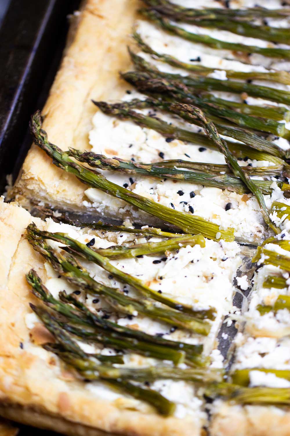 Asparagus Cheese Tart is a quick and easy, 30-Minute recipe. Made with puff pastry and a generous cheese filling, it has bold and interesting flavors, a unique idea for your next brunch.