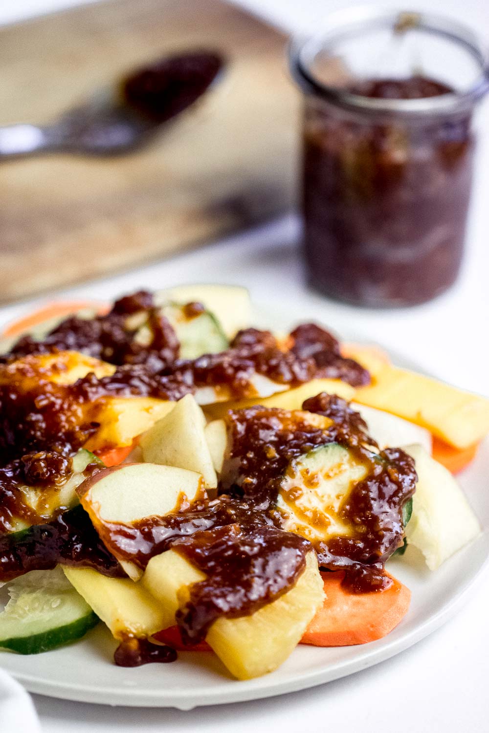 Rujak Buah, an Indonesian fruit salad, a scrumptious mix of spicy, sweet, salty, tangy, & crunchy textures all at once! This fruity & colorful salad is gluten-free and perfect for a crowd.