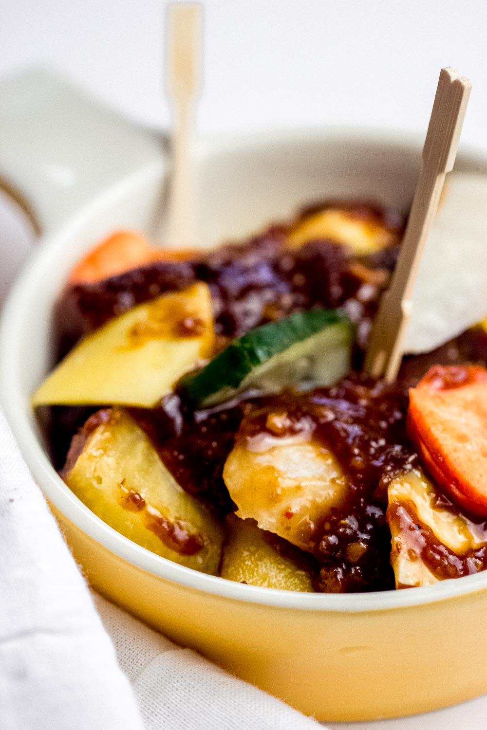 Rujak Buah, an Indonesian fruit salad, a scrumptious mix of spicy, sweet, salty, tangy, & crunchy textures all at once! This fruity & colorful salad is gluten-free and perfect for a crowd.