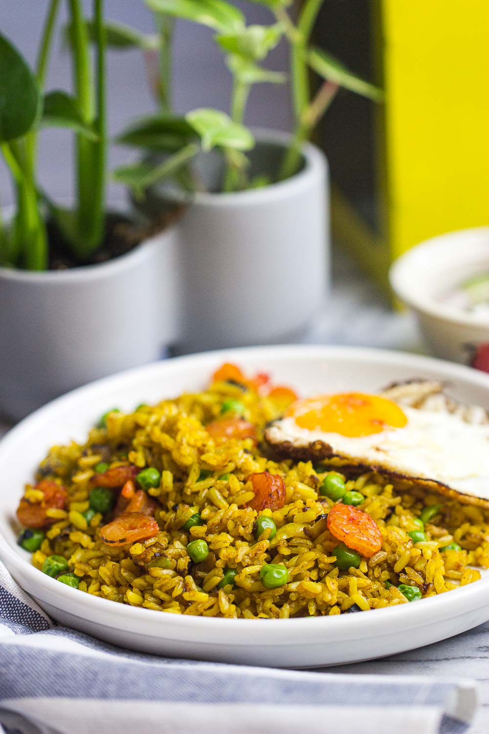 This skillet Turmeric Fried Rice (Indonesian Nasi Goreng Kunyit) recipe is a quick 30-minute meal that’s easy to make, flavorful, and only requires one pan. Great weeknight meal the entire family will love!