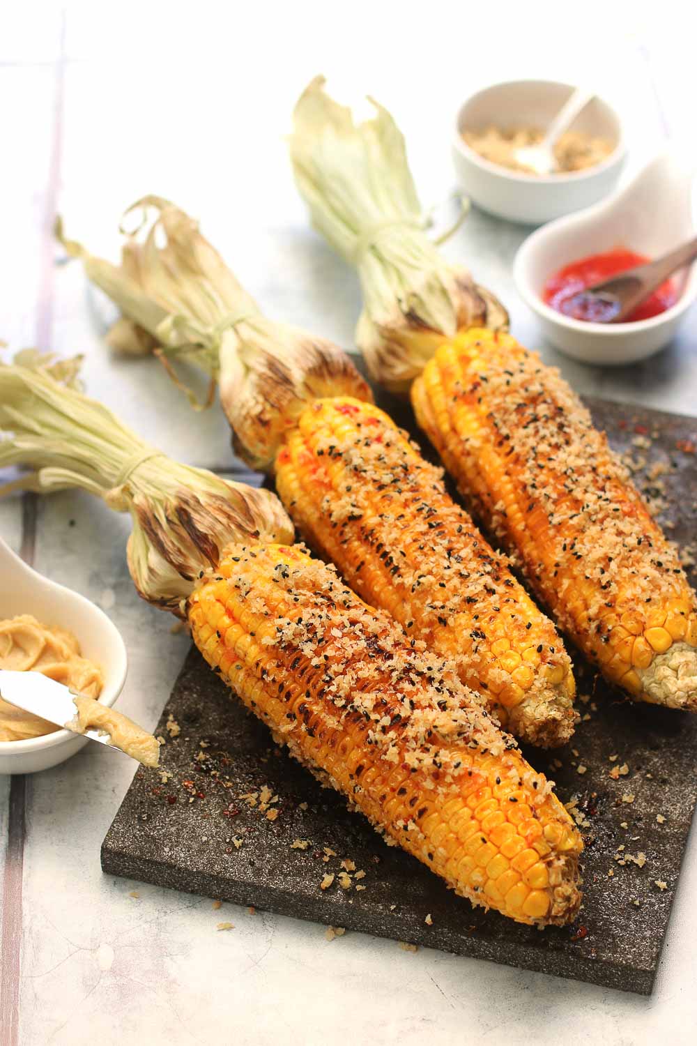This grilled corn with spicy miso takes grilled corn to the next level and is one you’ll be making on repeat! It’s full of flavor, easy to make, and the perfect blend of spicy, savory, and umami. Perfect when paired with grilled chicken skewers or grilled mussels.