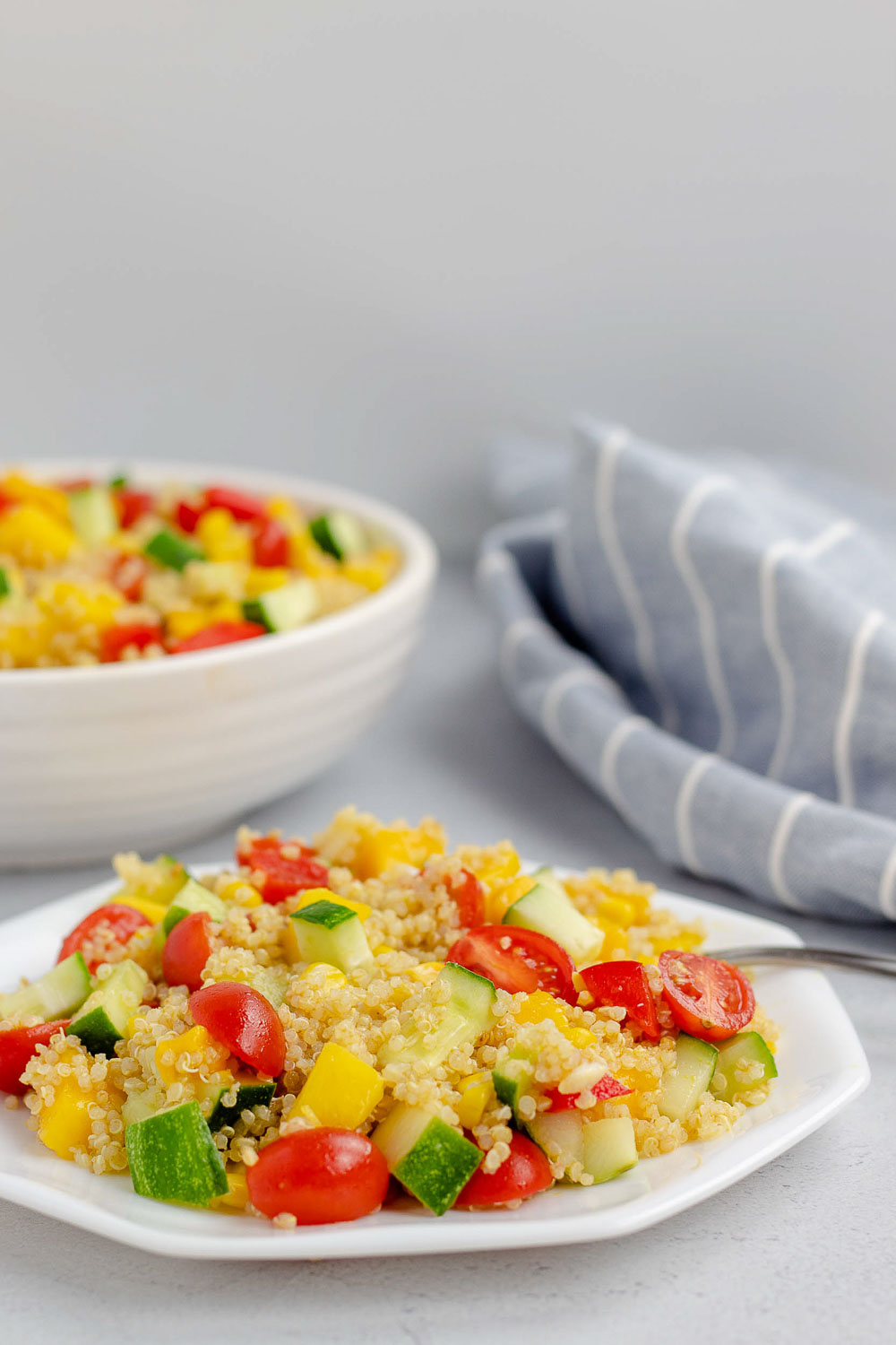 This 20-minute healthy mango quinoa salad is vegan, gluten-free, and perfect for entertaining. It will be your favorite easy lunch or summer salad that can be made ahead of time.