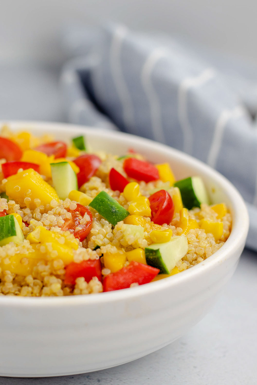 This 20-minute healthy mango quinoa salad is vegan, gluten-free, and perfect for entertaining. It will be your favorite easy lunch or summer salad that can be made ahead of time.