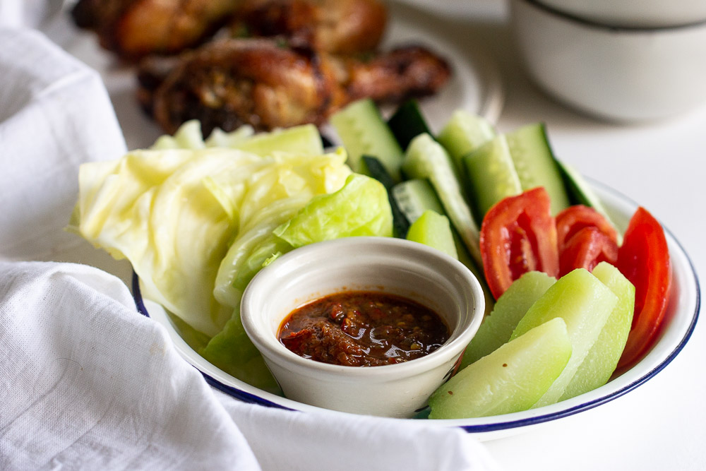 Learn how to prepare lalapan Sunda (Sundanese salad), Indonesian most popular vegetable platters that can be served cooked or raw with a side of sambal terasi and perfect with fried chicken.