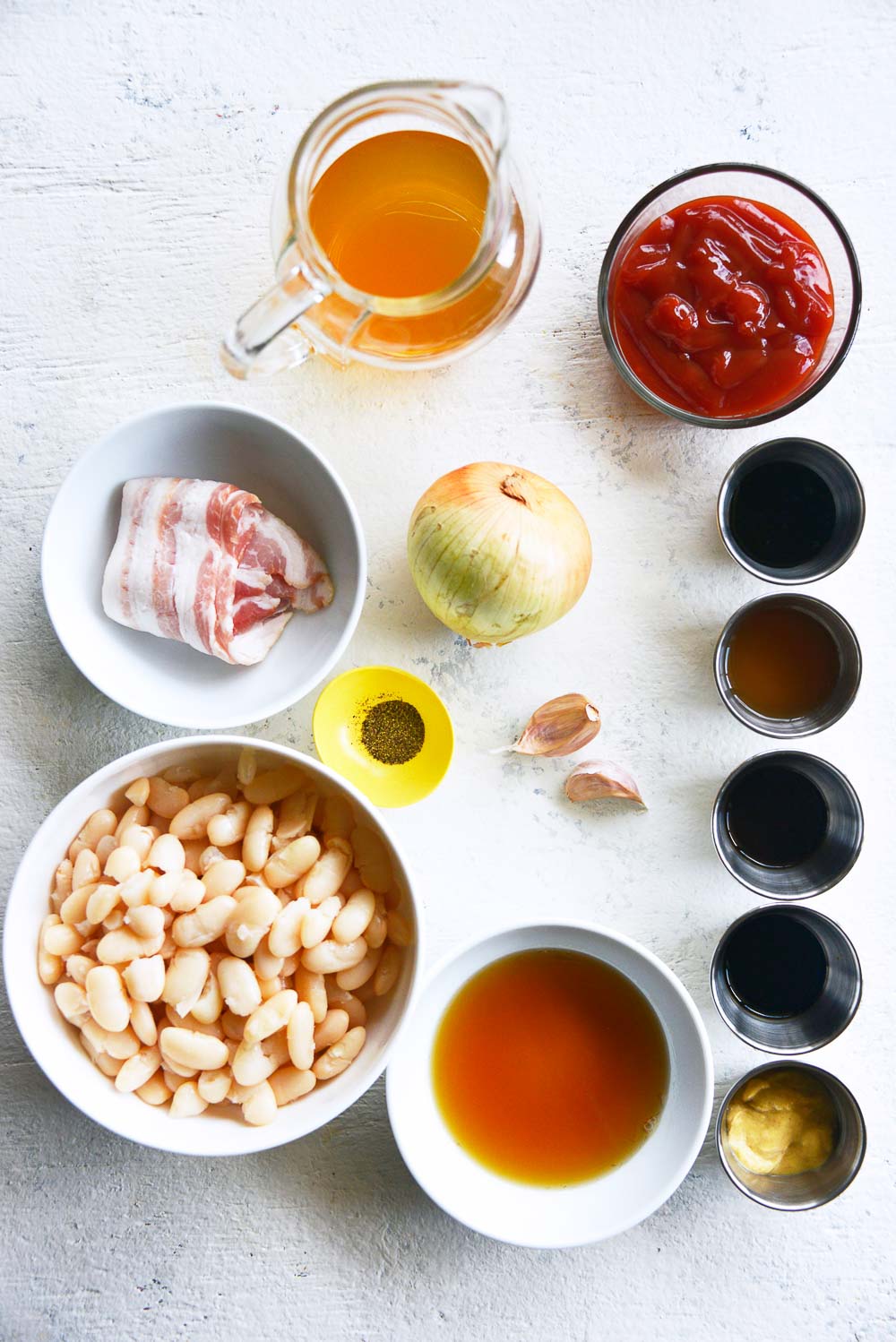 Homemade maple baked beans with bacon is a classic recipe that you can enjoy throughout the year. Sweet and smoky, these baked beans are so tender, easy to make, and can be easily adapted for your meatless Monday lineup. Learn how to cook this flavorful dish in 3 different ways - Dutch oven, slow cooker, Instant Pot.