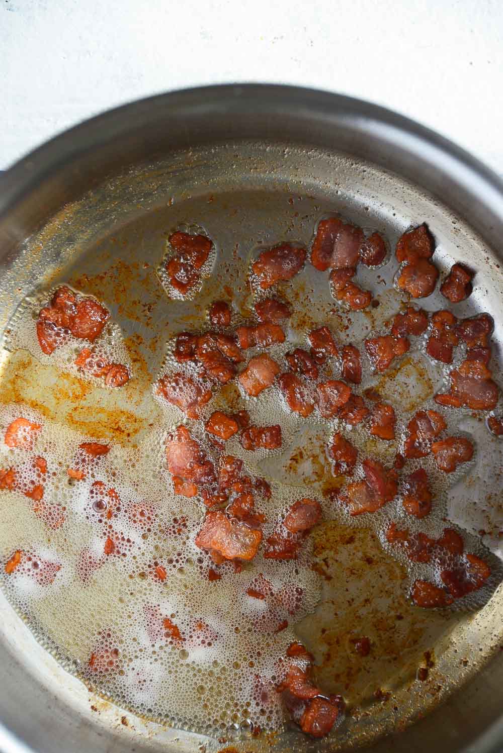 Homemade maple baked beans with bacon is a classic recipe that you can enjoy throughout the year. Sweet and smoky, these baked beans are so tender, easy to make, and can be easily adapted for your meatless Monday lineup. Learn how to cook this flavorful dish in 3 different ways - Dutch oven, slow cooker, Instant Pot.