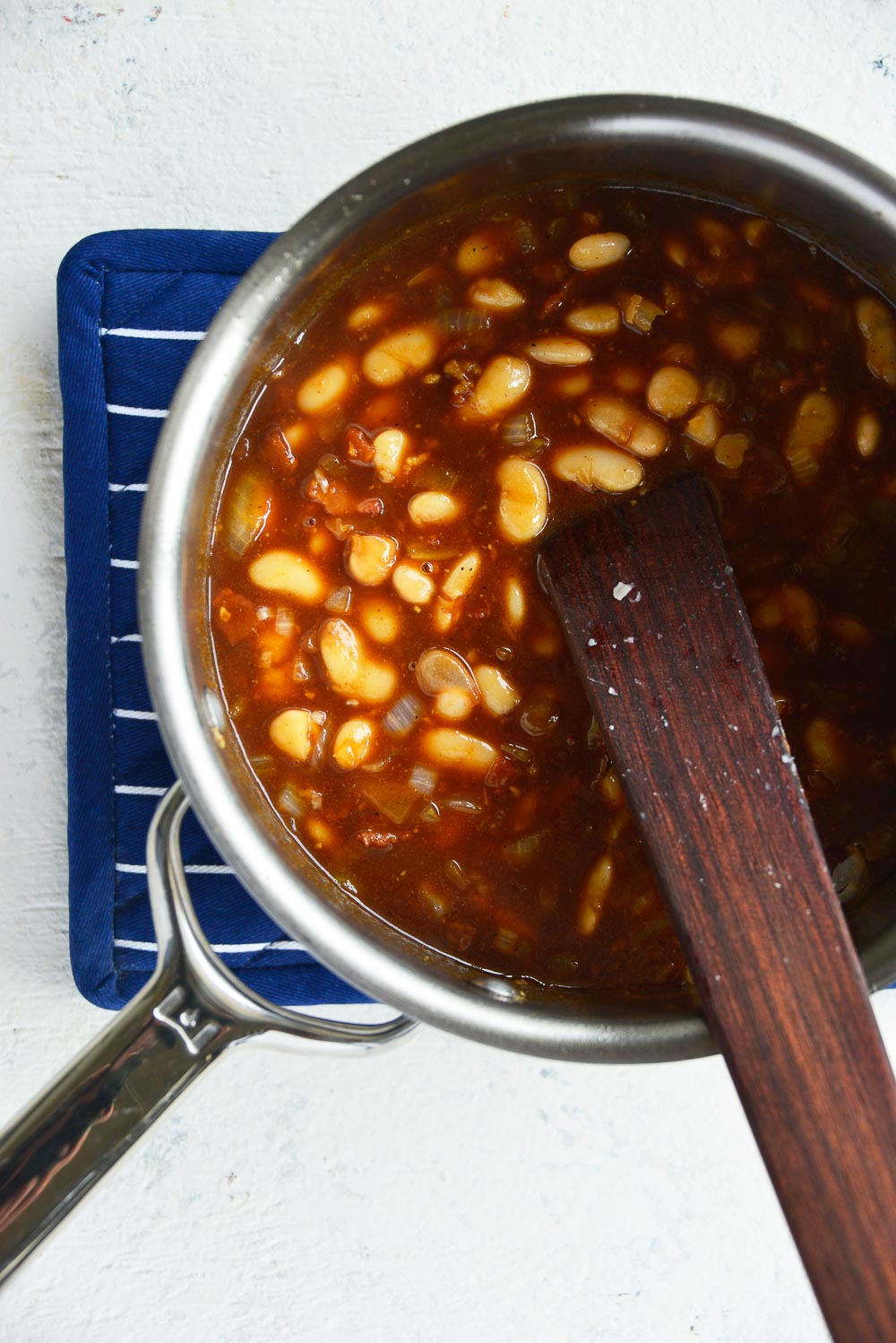 Homemade maple baked beans with bacon is a classic recipe that you can enjoy throughout the year. Sweet and smoky, these baked beans are so tender, easy to make, and can be easily adapted for your meatless Monday lineup. Learn how to cook this flavorful dish in 3 different ways - Dutch oven, slow cooker, Instant Pot. 