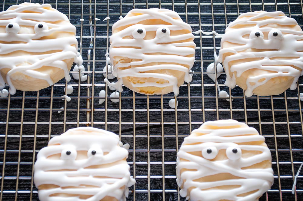 If you're looking for a last-minute idea for Halloween, you're on the right spot! These mummy cookies are not just fun to make but also only require three ingredients. Grab the kids because they will love helping you make these spooky and easy Halloween cookies.