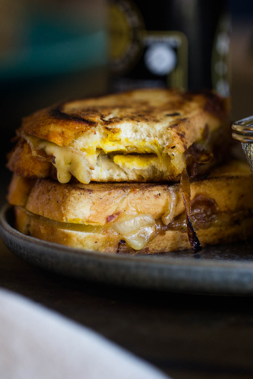 French Onion Grilled Cheese Sandwich with melty Gruyere and caramelized onions make the best comfort food. It has all the flavors of a classic French onion soup, but quicker to make and portable! Your taste buds will swoon!