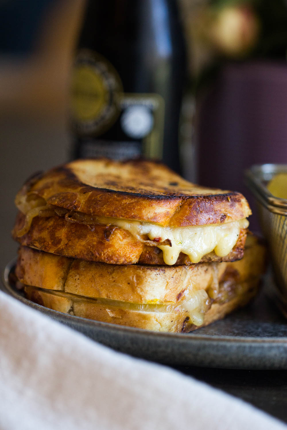 French Onion Grilled Cheese Sandwich with melty Gruyere and caramelized onions make the best comfort food. It has all the flavors of a classic French onion soup, but quicker to make and portable! Your taste buds will swoon!