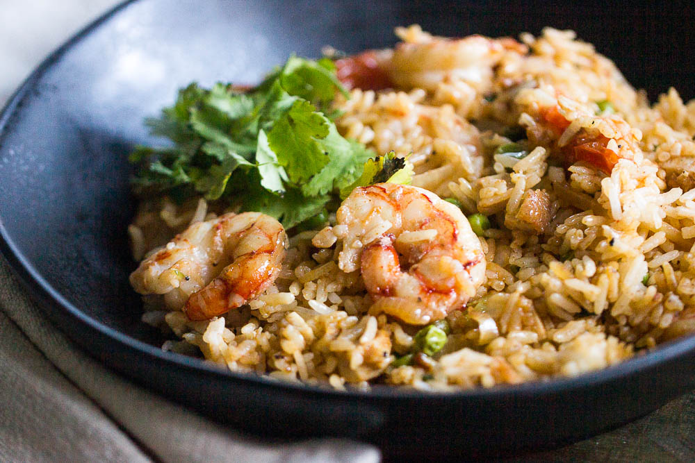 Need a quick weeknight meal? Try this easy Tom Yum Fried Rice with shrimp that you can make using ingredients from your pantry and freezer. Easy, quick, and yummy! Also, learn how to make this with instant chili paste or cauliflower rice.
