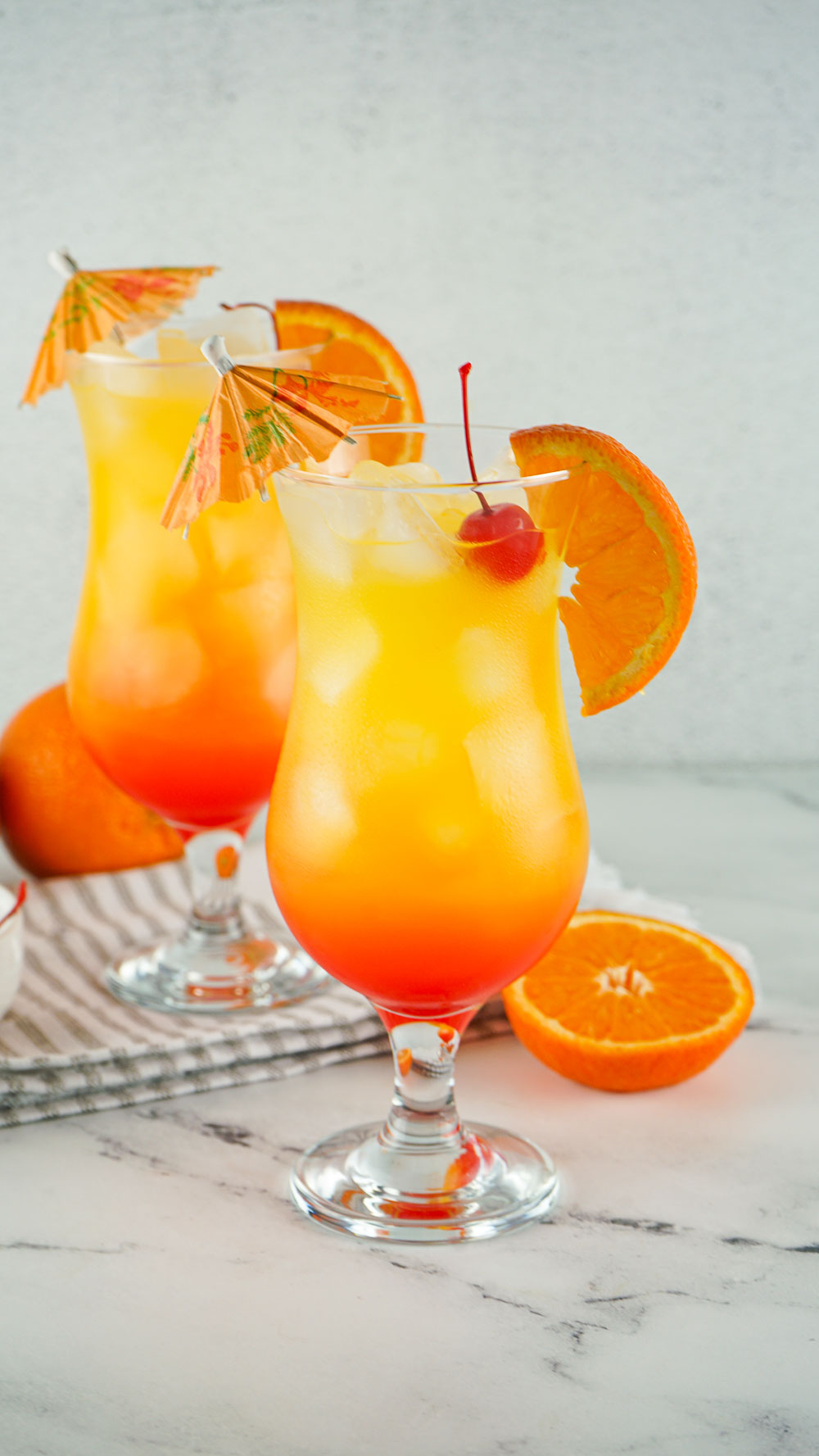 Best and refreshingly good tequila sunrise. This 3-ingredient classic cocktail never goes out of style! This drink is perfect for sipping by the pool or backyard parties and pairs wonderfully with easy pizza rolls, creamy asparagus puffs, and ham, egg, and cheese pockets. Learn how to easily layer a drink and enjoy this tropical cocktail with just a few ingredients.