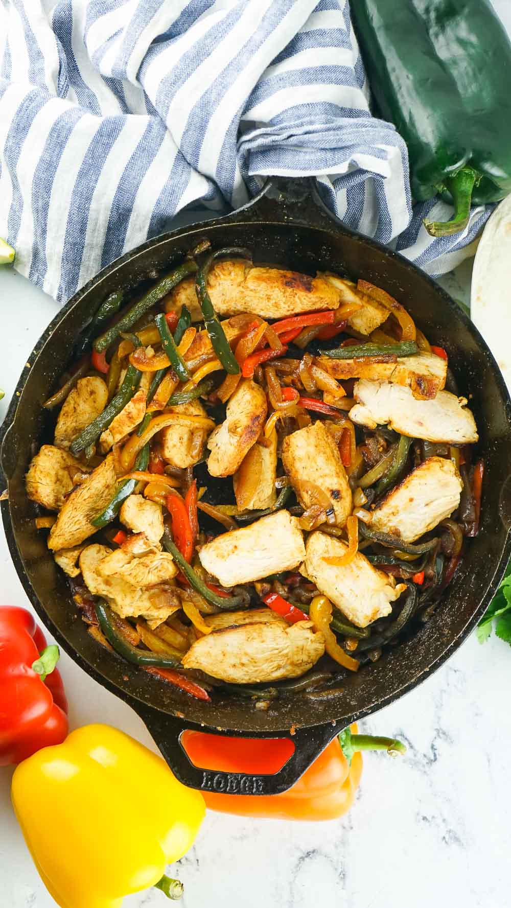 Looking for a quick 30-minute meal? This easy skillet chicken fajitas make a perfect weeknight dinner that can be served in so many ways!