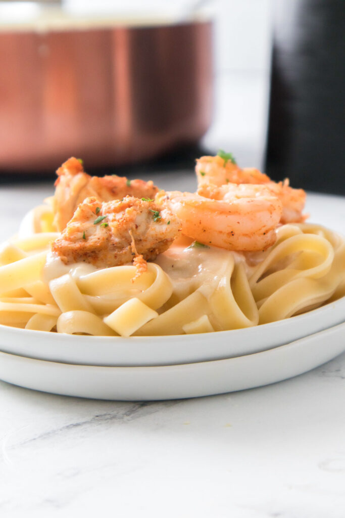 This air fryer chicken and shrimp alfredo recipe couldn’t be any simpler!