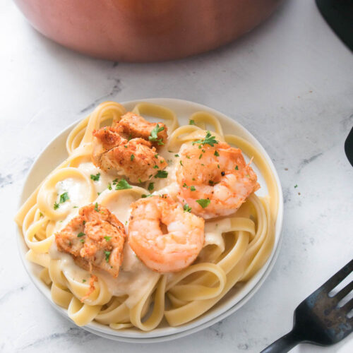 This air fryer chicken and shrimp alfredo recipe couldn’t be any simpler!