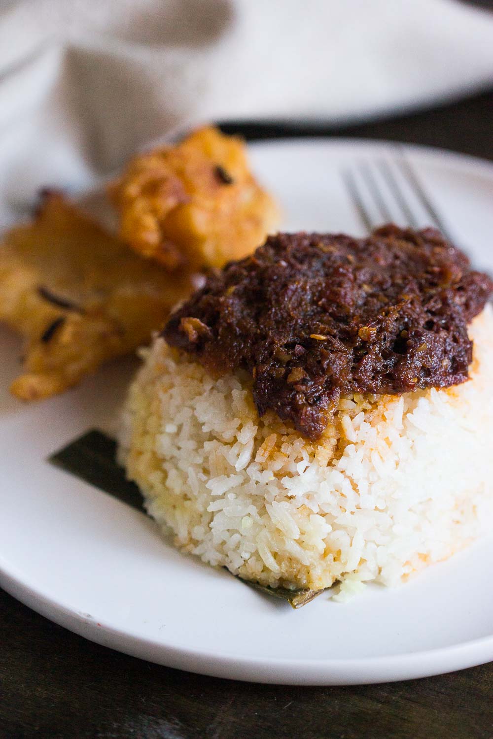 Fragrant nasi lemak or coconut rice makes a favorite dish for breakfast or any time of the day. Serve this with Javanese fried chicken, fried egg, and chili sauce for a delicious flavor of Indonesia. 