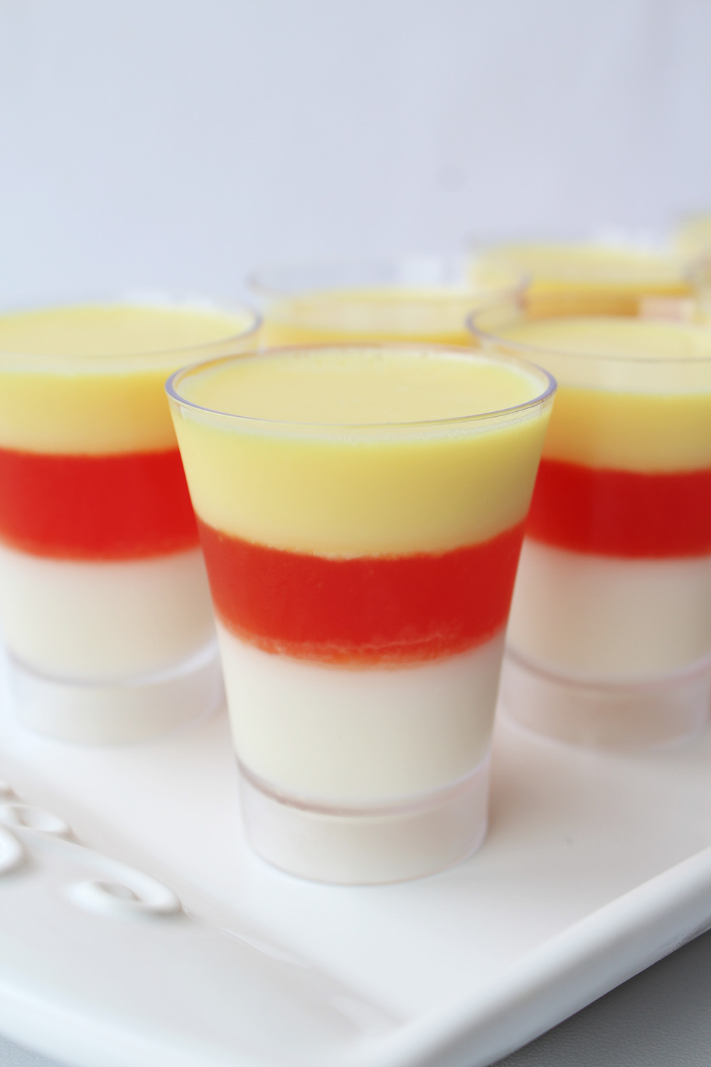 Fun, incredibly easy, and delicious; these candy corn Jello shots with Vodka make a tasty treat for your next Halloween. Not to mention that it's a hit with kids (be sure to skip the alcohol) and grown-ups (hello, Vodka jello shots!).