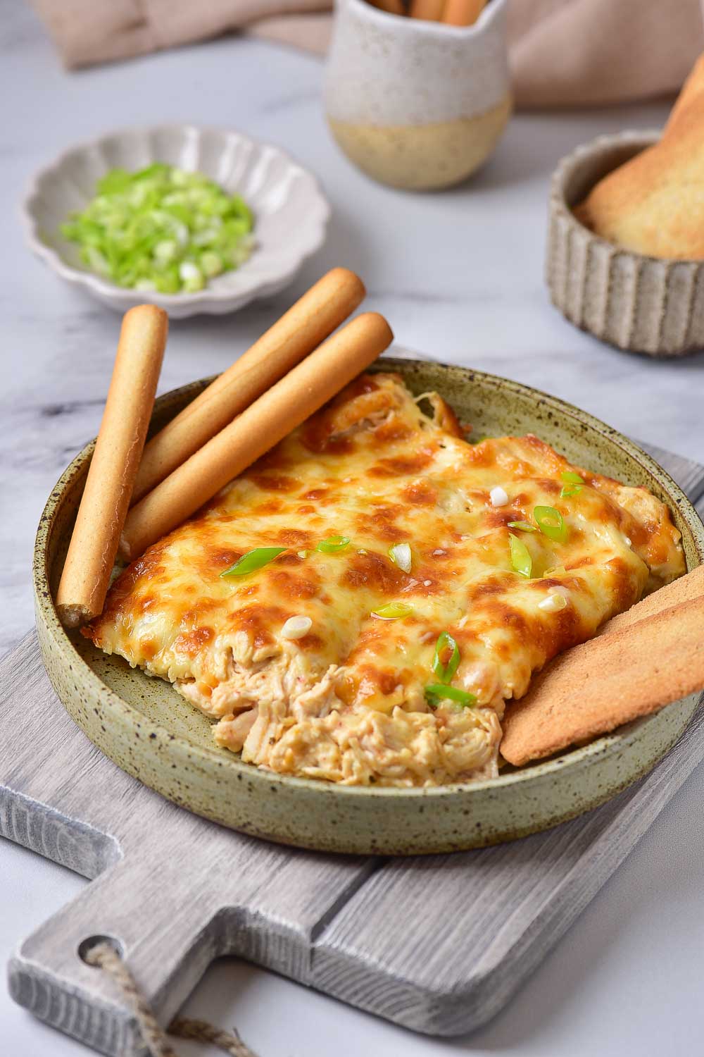 If you’d like to have Easy Baked Buffalo Chicken Dip, this creamy dip recipe is for you! If you're a fan of buffalo sauce, you won't want to miss this one. Serve this no-hassle dip over air fryer chicken, steak quesadillas, or jalapeno poppers! 