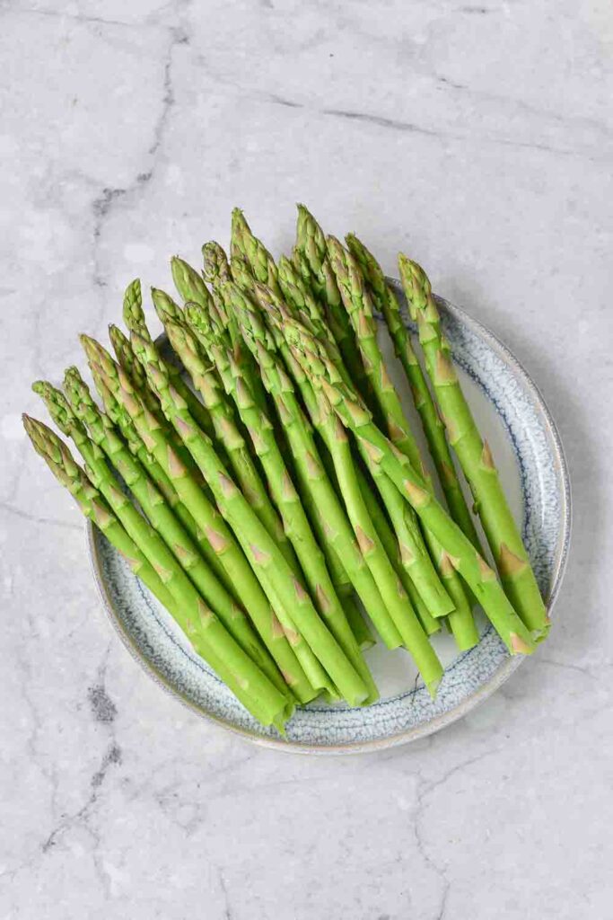 Crunchy, light, and ultra-fresh. This air fryer asparagus parmesan recipe is a quick, easy, and healthy side dish. 