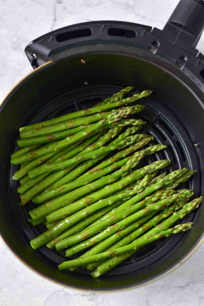 Crunchy, light, and ultra-fresh. This air fryer asparagus parmesan recipe is a quick, easy, and healthy side dish. 