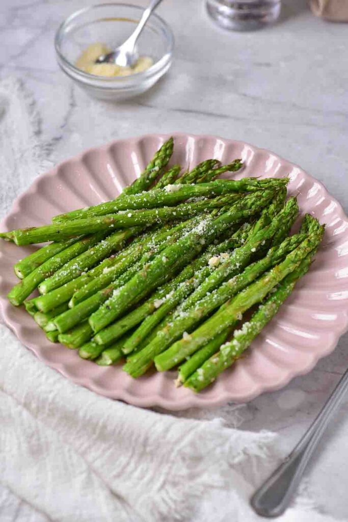 Crunchy, light, and ultra-fresh. This air fryer asparagus parmesan recipe is a quick, easy, and healthy side dish. 