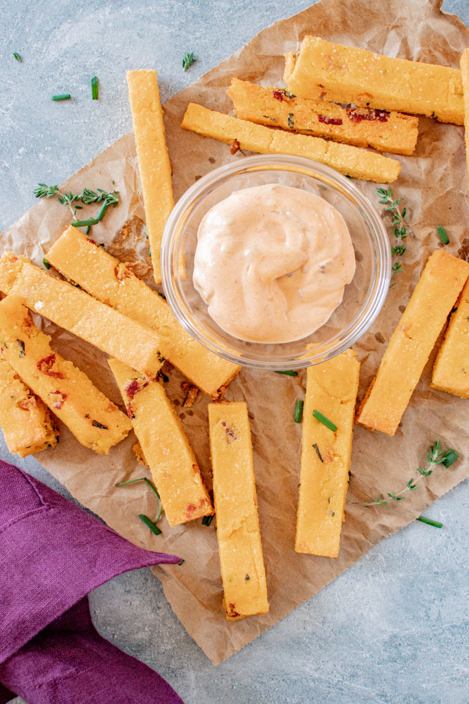 Golden baked cheddar bacon polenta fries with smoky chipotle aioli dip