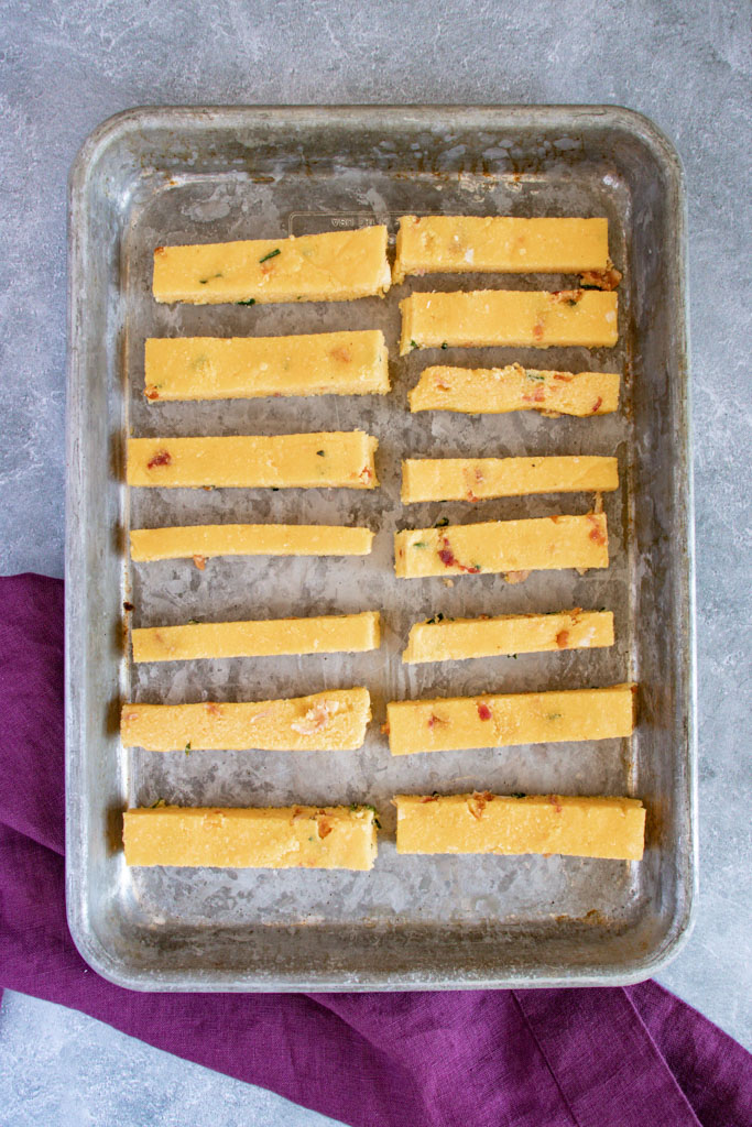 Golden baked cheddar bacon polenta fries with smoky chipotle aioli dip