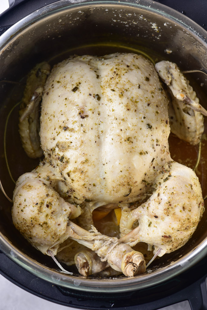 Juicy, tender Instant Pot whole chicken ready in under an hour — easy spices, lemon-garlic stuffing, oven crisp finish. Includes healthier swaps, high-protein ideas, and estimated macros.