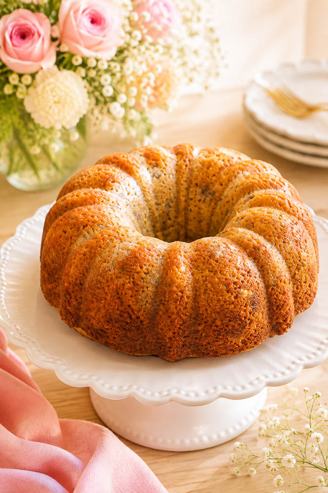 This moist Banana Bourbon Bundt Cake combines ripe bananas and bourbon with a rich dark chocolate ganache for an easy, decadent dessert
