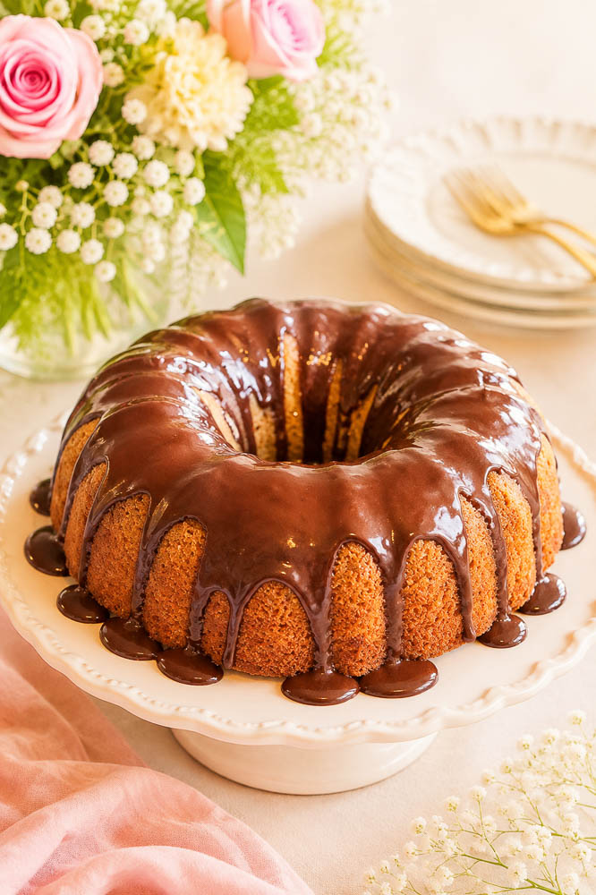 This moist Banana Bourbon Bundt Cake combines ripe bananas and bourbon with a rich dark chocolate ganache for an easy, decadent dessert