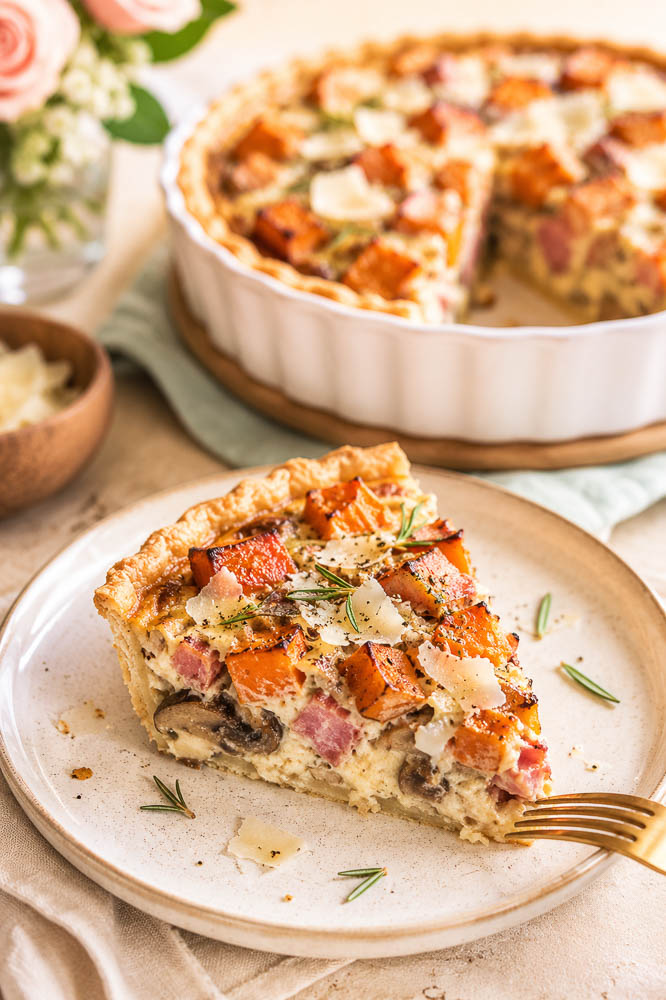 This savory Butternut Squash Pie combines sweet roasted squash, smoky ham, mushrooms, Parmesan, and rosemary in a flaky golden crust.