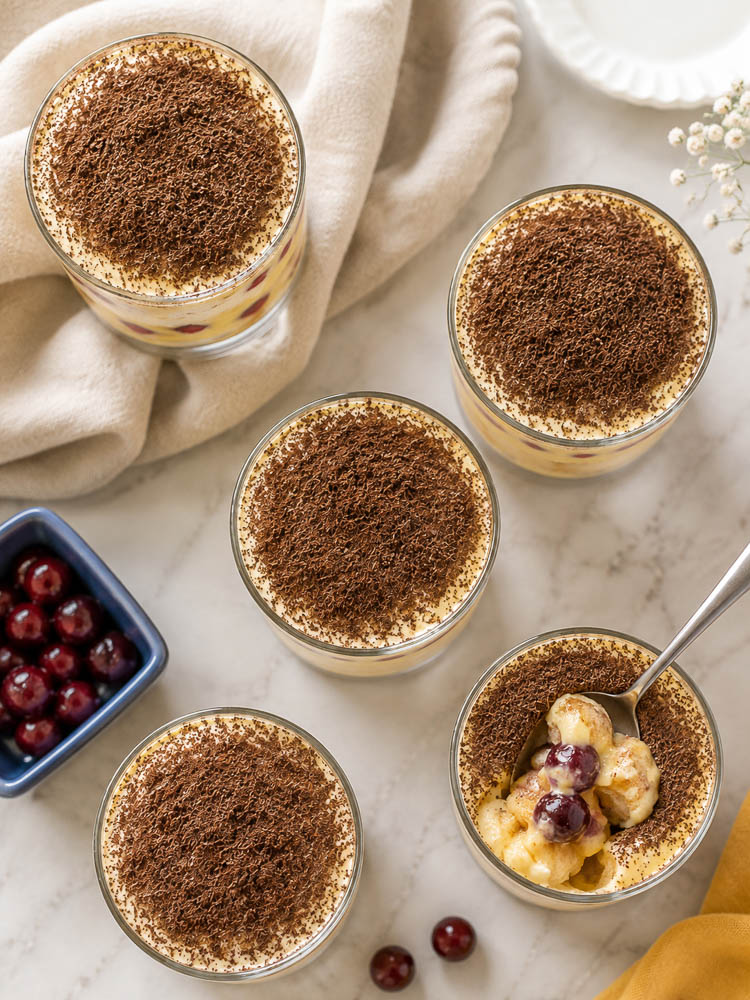 This Cranberry Tiramisu layers soft amaretto-brushed ladyfingers with creamy mascarpone custard and a bright, tangy cranberry sauce for an elegant twist on classic tiramisu.