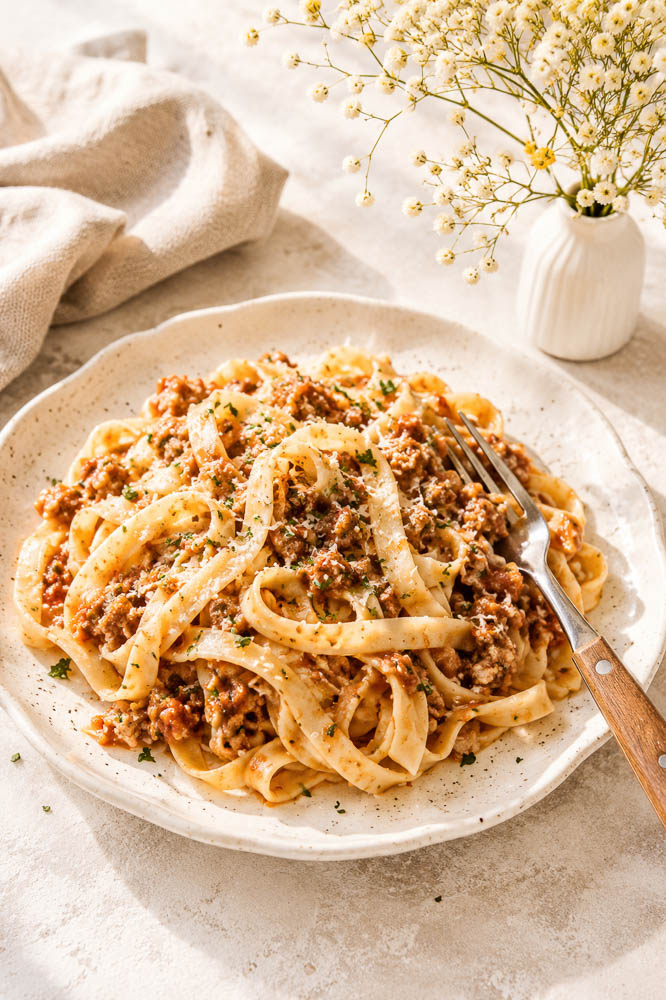 This Creamy Pumpkin Pasta combines savory ground beef, pumpkin, tomato, Parmesan, and cream in a rich, cozy sauce that comes together in about 30 minutes.