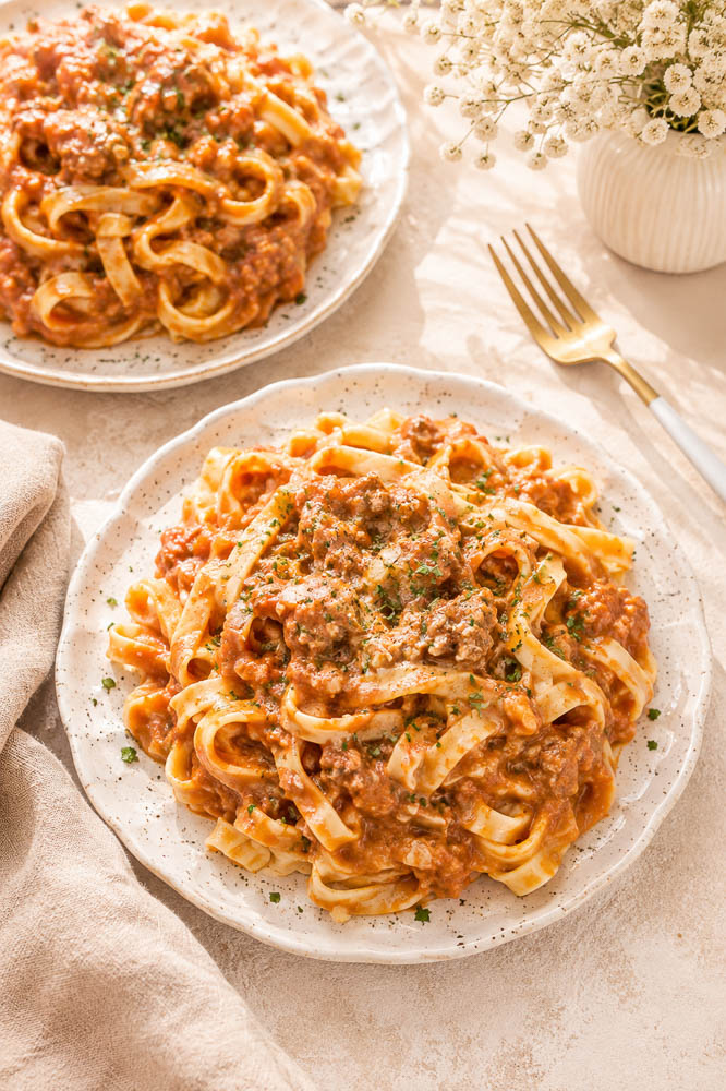This Creamy Pumpkin Pasta combines savory ground beef, pumpkin, tomato, Parmesan, and cream in a rich, cozy sauce that comes together in about 30 minutes.