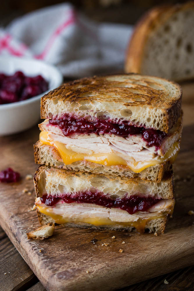 Turn leftover turkey into a crispy grilled cheese with melty cheddar and Gouda plus tangy cranberry sauce. An easy holiday leftover sandwich!