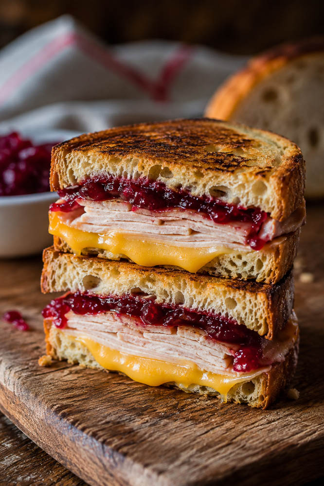 Turn leftover turkey into a crispy grilled cheese with melty cheddar and Gouda plus tangy cranberry sauce. An easy holiday leftover sandwich!